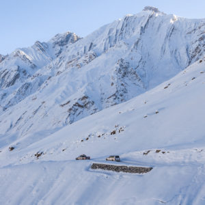 The expedition dwarfed by the landscape