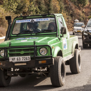 Utkarsh and Pragra ride in the green Gypsy